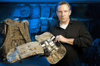 Image: Rich Landry displays the new Individual First Aid Kit (Photo courtesy of USAG-Natick Public Affairs).